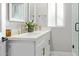Bright bathroom featuring a double vanity, quartz countertops, and modern fixtures at 1702 W Glenrosa Ave, Phoenix, AZ 85015