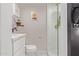 Modern bathroom featuring a glass-enclosed shower and vanity with white countertop at 1702 W Glenrosa Ave, Phoenix, AZ 85015