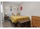 Cozy bedroom with vintage trunk, dresser, and comfortable bedding at 1702 W Glenrosa Ave, Phoenix, AZ 85015