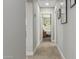Inviting hallway with wood floors that leads to a bright bedroom at 1702 W Glenrosa Ave, Phoenix, AZ 85015
