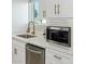 Kitchen featuring stainless steel appliances, a gold faucet, and white cabinetry at 1702 W Glenrosa Ave, Phoenix, AZ 85015