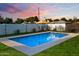 Backyard pool with an umbrella and lounge chairs at 1702 W Glenrosa Ave, Phoenix, AZ 85015
