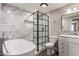 Beautiful bathroom featuring a soaking tub, updated shower with glass, and marble tile surround at 1713 W Palomino Dr, Chandler, AZ 85224
