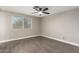 Neutral bedroom with wood-look floors and a bright window at 1713 W Palomino Dr, Chandler, AZ 85224