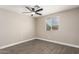 Bedroom featuring wood-look floors, a modern ceiling fan, and neutral paint tones at 1713 W Palomino Dr, Chandler, AZ 85224