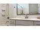 Well lit bathroom with modern sink and shower and bathtub combo at 17211 W Whispering Wind Rd, Surprise, AZ 85387