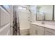 Bright bathroom featuring a shower-tub combo and vanity with countertop at 17211 W Whispering Wind Rd, Surprise, AZ 85387