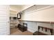 Walk-in closet featuring shelving, hanging rods, and a small trunk at 17211 W Whispering Wind Rd, Surprise, AZ 85387