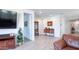 Open living space with tile flooring and ample natural light, perfect for relaxing or entertaining at 17211 W Whispering Wind Rd, Surprise, AZ 85387