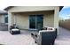A covered outdoor patio with stylish seating, perfect for relaxation and entertaining at 17211 W Whispering Wind Rd, Surprise, AZ 85387