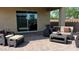 Inviting outdoor patio featuring comfortable wicker furniture, ideal for outdoor living at 17211 W Whispering Wind Rd, Surprise, AZ 85387