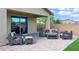 Inviting outdoor patio featuring comfortable wicker furniture, ideal for outdoor living at 17211 W Whispering Wind Rd, Surprise, AZ 85387