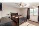 Bedroom featuring a ceiling fan, ample sunlight, and two dressers at 1737 E Primera Dr, Casa Grande, AZ 85122