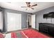 Bedroom featuring a ceiling fan, dark dresser, and closet at 1737 E Primera Dr, Casa Grande, AZ 85122