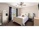 Bedroom features a ceiling fan, a window, and stylish decor at 1737 E Primera Dr, Casa Grande, AZ 85122