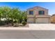 Charming two-story home featuring a two-car garage and low maintenance landscaping at 1737 E Primera Dr, Casa Grande, AZ 85122