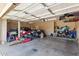 Spacious two-car garage filled with motorcycles, storage, and equipment; features ample lighting at 1737 E Primera Dr, Casa Grande, AZ 85122