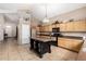 Kitchen featuring a center island, wooden cabinetry, and neutral decor at 1737 E Primera Dr, Casa Grande, AZ 85122