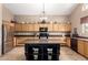 Bright kitchen featuring a center island, tiled floors and stainless steel appliances at 1737 E Primera Dr, Casa Grande, AZ 85122