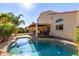 Beautiful backyard pool with well manicured lawn and covered patio area at 1737 E Primera Dr, Casa Grande, AZ 85122