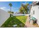 Manicured backyard with lush green lawn and privacy fencing provides a serene outdoor space at 1747 W Echo Ln, Phoenix, AZ 85021