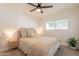 Comfortable bedroom with neutral tones, plush carpet, and ample natural light at 1747 W Echo Ln, Phoenix, AZ 85021