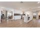 Spacious kitchen with island, stainless appliances, and open concept design to dining area at 1747 W Echo Ln, Phoenix, AZ 85021