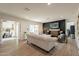 Bright living room with black brick fireplace and wood floors provides a modern, inviting space at 1747 W Echo Ln, Phoenix, AZ 85021