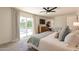 Bright main bedroom with sliding glass doors to the pool and modern decor at 1747 W Echo Ln, Phoenix, AZ 85021
