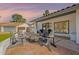 Inviting patio area with comfortable seating around a fire pit, perfect for outdoor entertaining at 1747 W Echo Ln, Phoenix, AZ 85021
