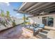 Inviting covered patio with comfortable seating, perfect for outdoor relaxation and entertainment at 1747 W Echo Ln, Phoenix, AZ 85021