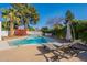 Relaxing pool area with lounge chairs and a lush landscape, ideal for enjoying sunny days at 1747 W Echo Ln, Phoenix, AZ 85021