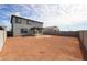 Large backyard with a covered patio, block wall fencing and red dirt at 17977 W Camino De Oro Riv, Surprise, AZ 85387