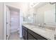 Bathroom with granite countertops, double sinks, tiled floors, and a shower and tub at 17977 W Camino De Oro Riv, Surprise, AZ 85387