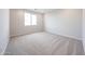 Bedroom featuring neutral carpeting, recessed lighting, and a bright window at 17977 W Camino De Oro Riv, Surprise, AZ 85387