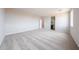 Large bedroom featuring neutral carpet, recessed lighting, and an open doorway to the bathroom at 17977 W Camino De Oro Riv, Surprise, AZ 85387