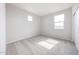 The bedroom features two windows, neutral carpet, closet, and a simple, clean aesthetic at 17977 W Camino De Oro Riv, Surprise, AZ 85387