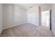 Cozy bedroom with neutral carpet flooring and a sliding door closet for storage at 17977 W Camino De Oro Riv, Surprise, AZ 85387