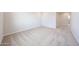 Bedroom showcasing neutral carpeting, recessed lighting, and an open doorway at 17977 W Camino De Oro Riv, Surprise, AZ 85387