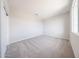 This bedroom features neutral carpet, ample natural light and a simple, clean aesthetic at 17977 W Camino De Oro Riv, Surprise, AZ 85387