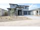 Stunning two-story home featuring a desert landscape and stone accents at 17977 W Camino De Oro Riv, Surprise, AZ 85387