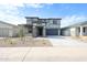 Attractive two-story home featuring desert landscaping and a welcoming entrance at 17977 W Camino De Oro Riv, Surprise, AZ 85387