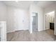 Bright foyer featuring neutral tile flooring and easy access to the downstairs powder room at 17977 W Camino De Oro Riv, Surprise, AZ 85387
