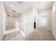 Hallway with neutral carpet, white walls, and doors leading to other rooms in the house at 17977 W Camino De Oro Riv, Surprise, AZ 85387