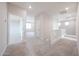Second floor hallway with carpet flooring and access to the bedrooms and bathrooms at 17977 W Camino De Oro Riv, Surprise, AZ 85387