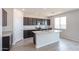 Kitchen view showcases dark cabinets, stainless appliances, granite counters, and a center island at 17977 W Camino De Oro Riv, Surprise, AZ 85387