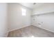 A conveniently located laundry room with modern tile flooring and plenty of space for appliances at 17977 W Camino De Oro Riv, Surprise, AZ 85387