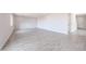 Open living area with tile flooring and neutral paint at 17977 W Camino De Oro Riv, Surprise, AZ 85387