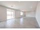 Spacious living area with sliding glass doors to the backyard at 17977 W Camino De Oro Riv, Surprise, AZ 85387