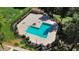 Aerial view of community pool surrounded by manicured landscaping, lounge chairs, and fenced in area at 18811 N 34Th Ave # 6, Phoenix, AZ 85027